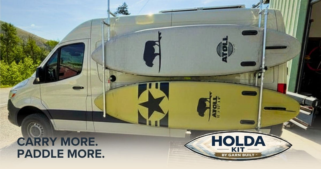 2026 Holda Kit van rack mounted on a Sprinter van holding stand-up paddleboards and a surfboard